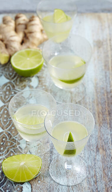 Glasses of homemade lime and ginger liqueur — Stock Photo