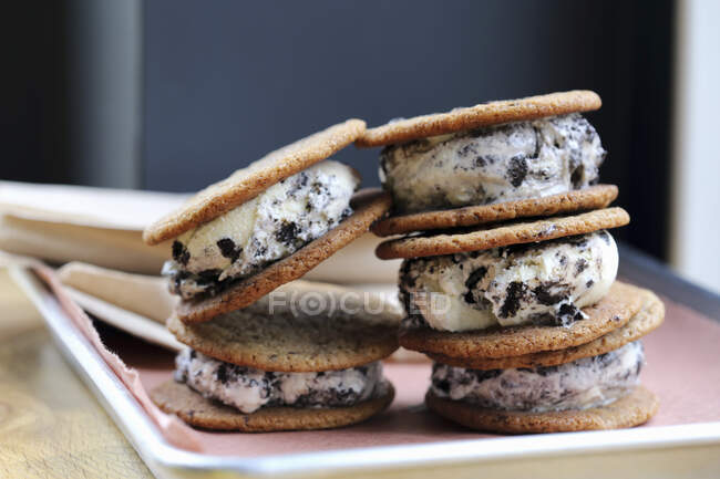 Pile of oversized cookies and cream ice cream sandwiches — Stock Photo