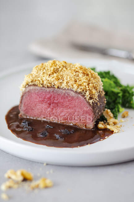 Pink fried venison with a nut crust — Stock Photo