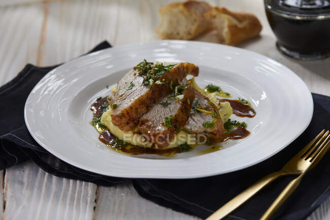 Roast veal with polenta and gremolata — Stock Photo