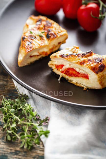 Grilled chicken breast stuffed with mozzarella and tomatoes — Stock Photo