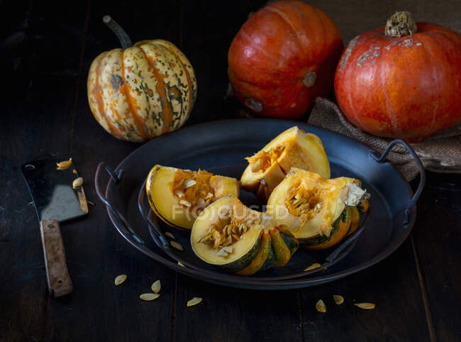 Pumpkins and squashes with squash cut open — Stock Photo