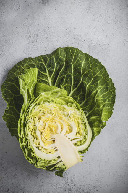Fresh green cabbage on grey background — Stock Photo