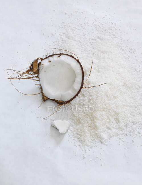 Close-up shot of delicious Coconuts and grated coconut — Stock Photo