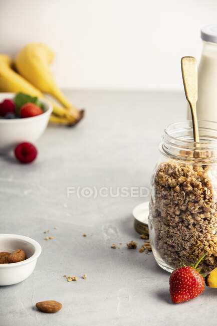 Close-up shot of delicious Homemade granola in a glass jar — Stock Photo