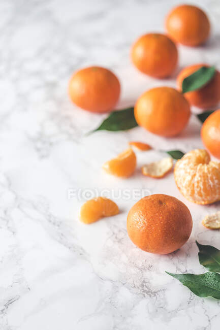 Fresh clementines on a marble surface — Stock Photo