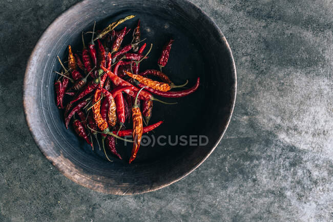 Red chili pepper on a black background. top view. — Stock Photo