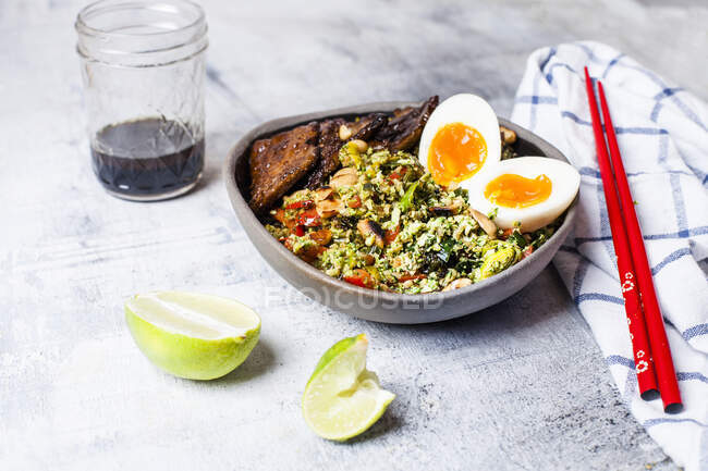 Thai broccoli rice with spicy dressing, eggs, and beef — Stock Photo