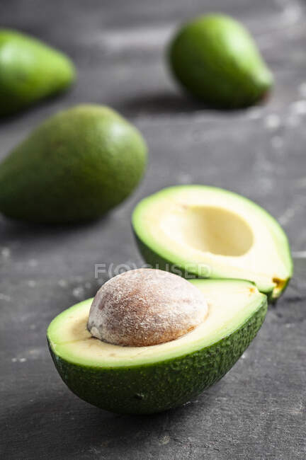 Fresh avocado on wooden background — Stock Photo
