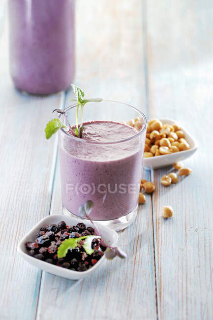 Blueberry peanut smoothie on table — Stock Photo
