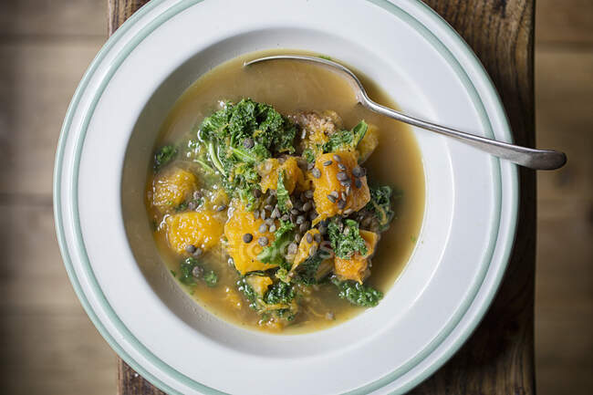 Bowl of Sausages, Butternut and Kale Soup — Stock Photo