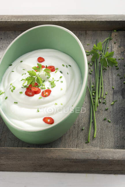 Yoghurt quark with herbs and chilli rings — Stock Photo