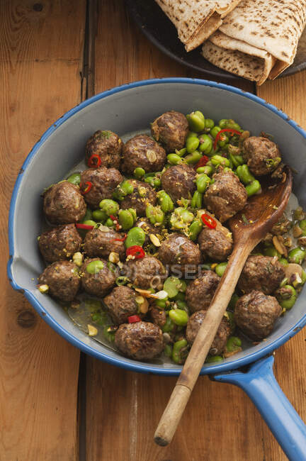 Spiced meatballs with broad beans — Stock Photo