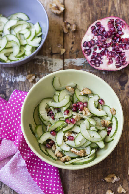 Summer cucumber, walnut and pomegranate — Stock Photo