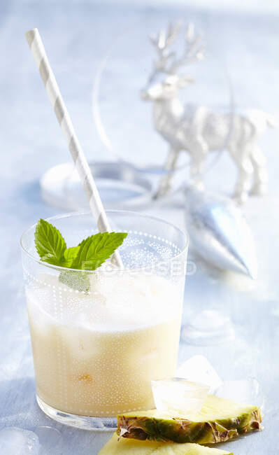 Christmas cocktail with amaretto, passion fruit juice, cream of coconut and cream — Stock Photo