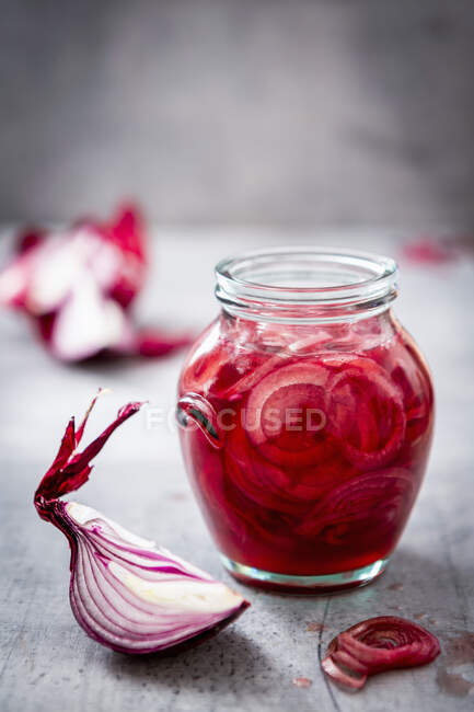 Red chili pepper in a glass jar on a wooden background. selective focus. — Stock Photo