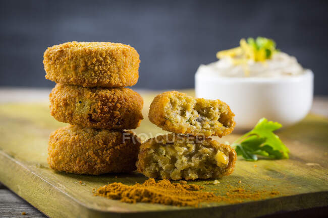 Fried chicken nuggets with sesame seeds and cheese — Stock Photo