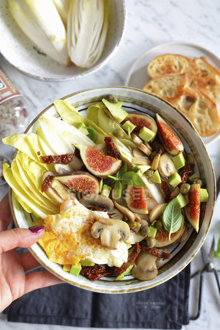 Salad with figs mushrooms and egg — Stock Photo