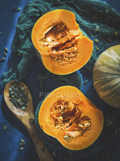 Raw pumpkin cut in halves — Stock Photo