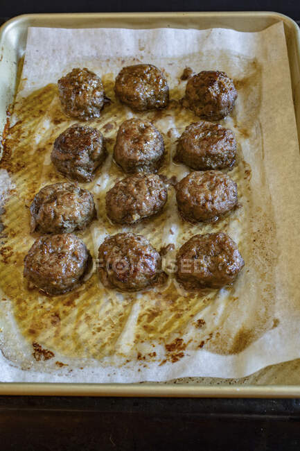 Meatballs on a baking tray — Stock Photo