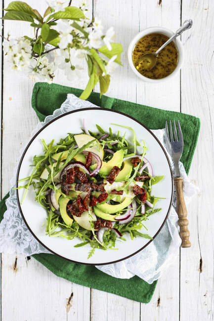 Arugula salad with pears and avocado, top view — Stock Photo