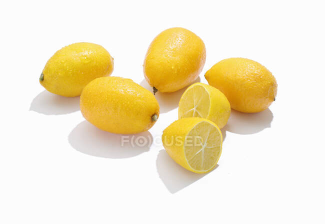 Limequats, whole and halved — Stock Photo