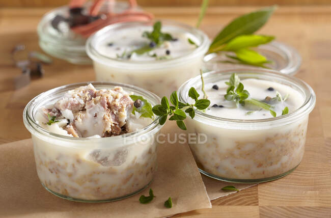 Pork rillettes canned in mason jars with fresh herbs — Stock Photo