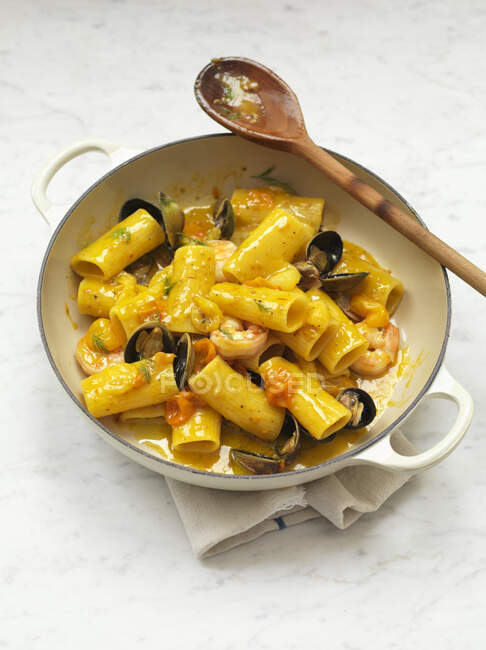 Paccheri with seafood and saffron — Stock Photo