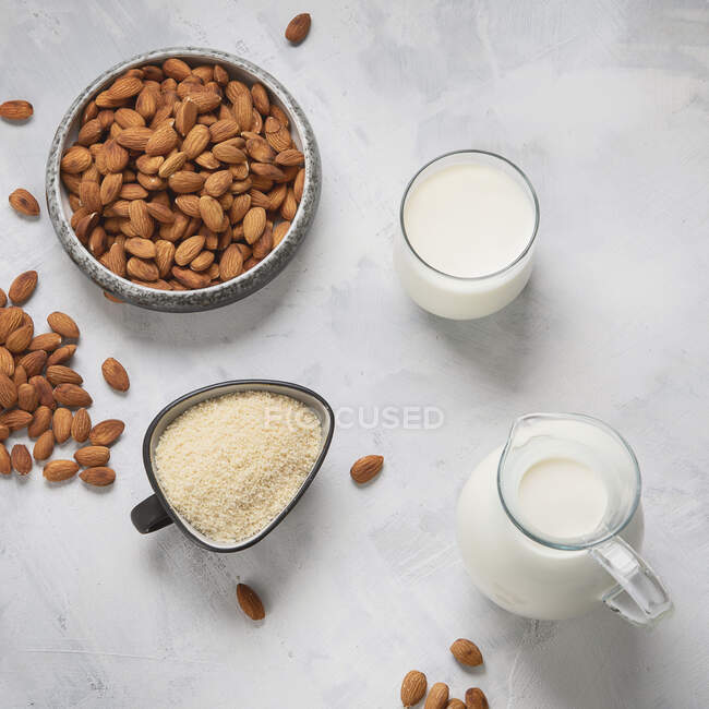 Almond milk, almond flour and almonds — Stock Photo