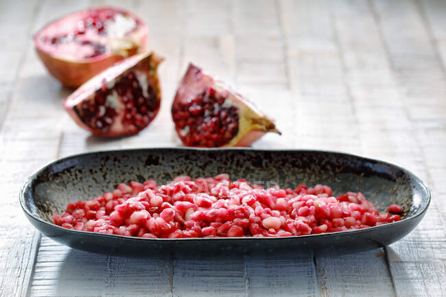 Close-up shot of delicious Pomegranate seeds in a dish — Stock Photo