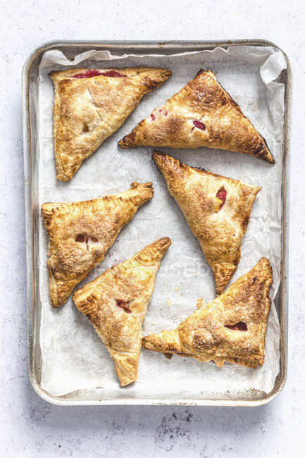 Nectarine and raspberry puff pastry turnovers — Stock Photo