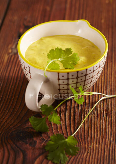 Exotic curried banana sauce with coriander for a fondue — Stock Photo