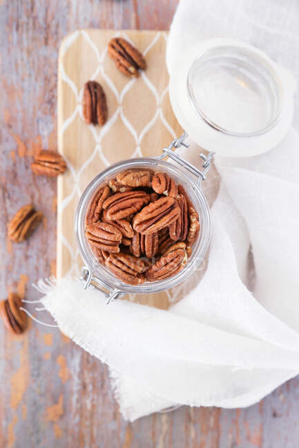 Close-up shot of delicious Pecans in a jar — Stock Photo