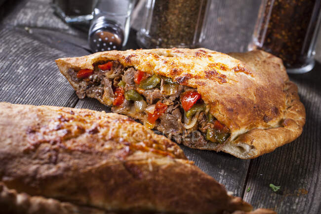 Calzone with meat and peppers — Stock Photo