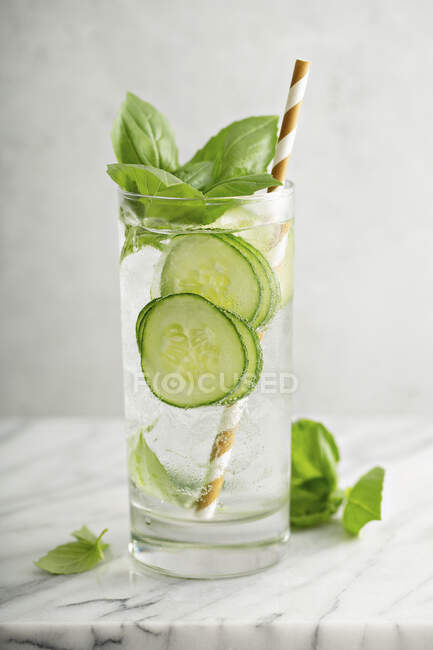 Refreshing basil cucumber cooler in a tall glass — Stock Photo