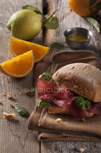A bresaola roll with spinach — Stock Photo