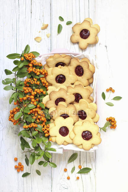Flowers shaped biscuits with jam and sea buckthorn — Stock Photo