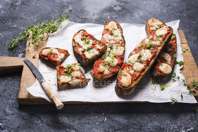 Baked toasted smoked flour bread with paprika paste and vegan almond cheese — Stock Photo