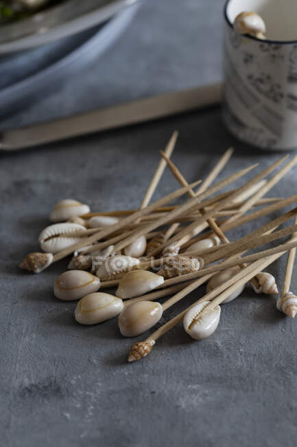 Toothpicks decorated with tiny shells — Stock Photo