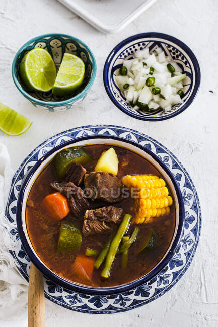 Mole De Olla, Mexican soup made from prickly pears, beef chambarete and aguja pork shoulder — Stock Photo