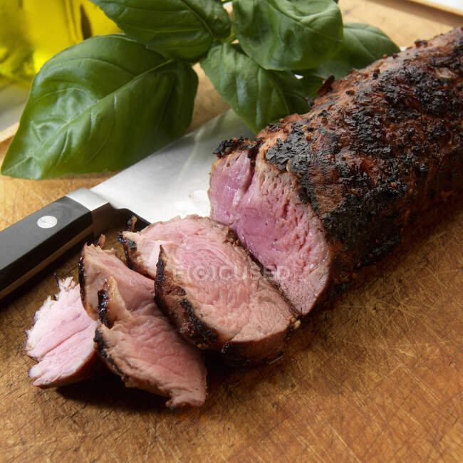 Close-up shot of delicious Sliced grilled pork tenderloin with herb rub — Stock Photo