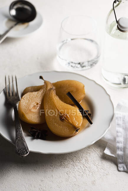 Poached pear with cinnamon — Stock Photo