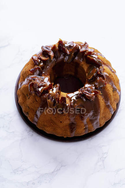 Festive bundt cake with dates and salted caramel — Stock Photo