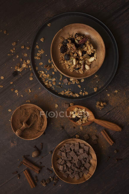 Granola ingredietns in shot including cinnamon and chocolate chips — Stock Photo