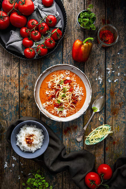Pepper and tomato soup with cheese and rice — Stock Photo