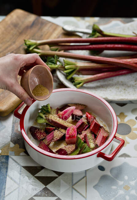 Chopped rhubarb Being Sugared — Stock Photo