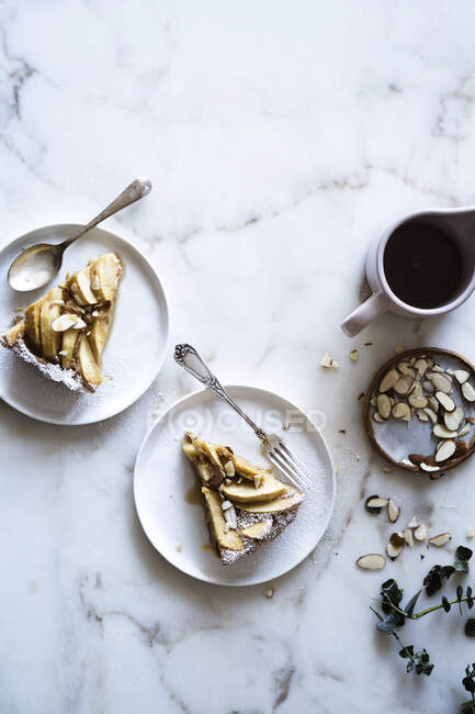 Two pieces of apple cake with almonds — Stock Photo