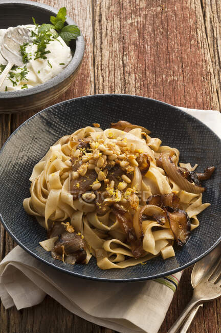 Pasta with fried onions — Stock Photo