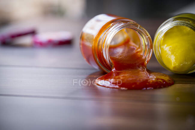 Dropped jars with sauce — Stock Photo