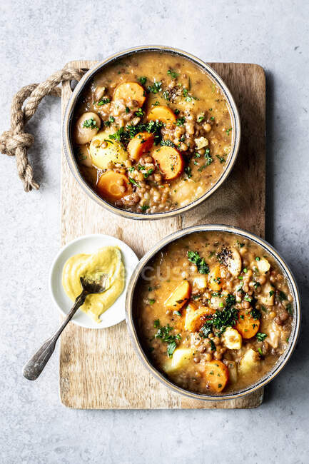 Vegetarian lentil soup with potatoes and carrots — Stock Photo